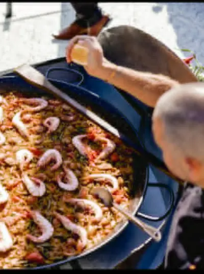 Fresh paella cooking at a food event